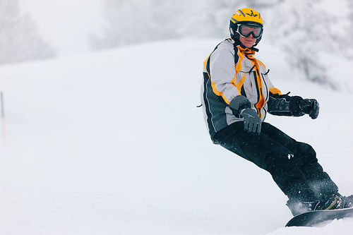 Snowboarder in the alps doing downhill