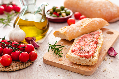 rustic bread, tomato and olive oil ready to make toasts