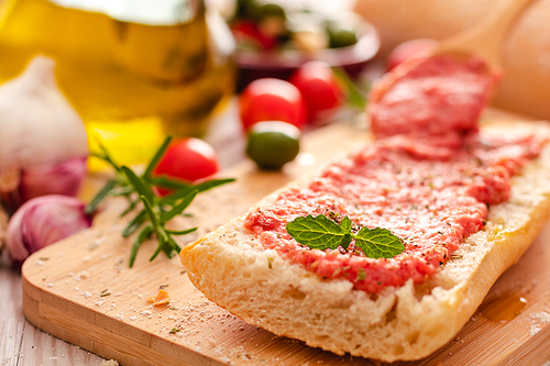 rustic bread, tomato and olive oil ready to make toasts