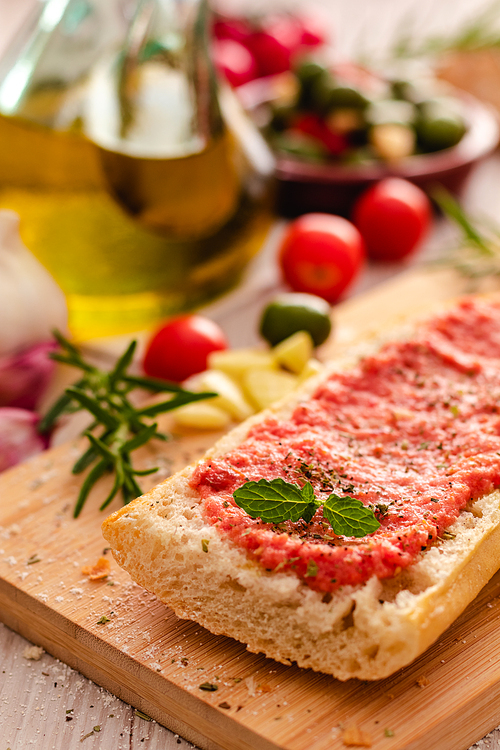 rustic bread, tomato and olive oil ready to make toasts