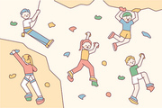 많은 사람들이 실내 암벽등반 벽을 오르고 있다.