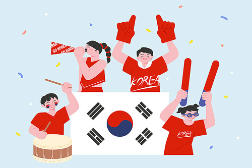 붉은 악마 응원단이 여러가지 응원도구를 들고 축구 응원을 하고 있다.