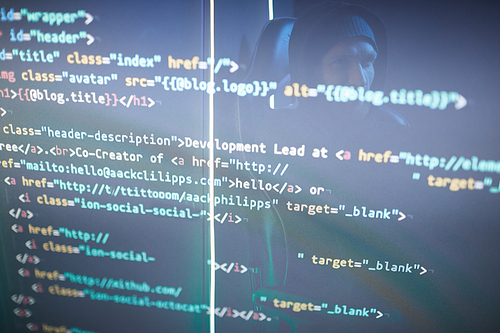 Image of computer symbols on black computer monitor with computer hacker