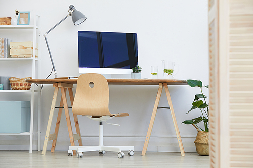 Image of modern workplace with computer monitor on it in the domestic room