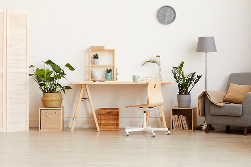 Image of modern domestic room with wooden table and sofa