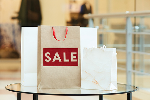 Close-up of paper shopping bags are on the table buyed during sale in the shopping mall