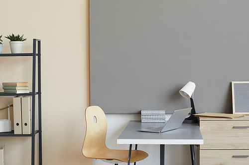 Image of empty modern workplace with laptop at office