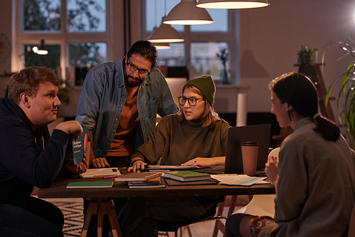 Group of business people sitting at the table and planning work together in team at office