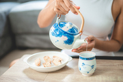 Asian woman person relaxing with hot tea to drink at home, tea cup for happy lifestyle in morning