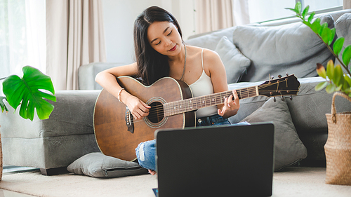 woman person playing acoustic guitar music instrument at home, young Asian musician girl lifestyle