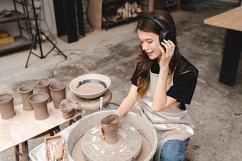 handcraft artist person using art skill of creativity to making ceramic clay craft pottery workshop by hand finger, wet and dirty work with mud for shape bowl traditional in hobby or manufacturing