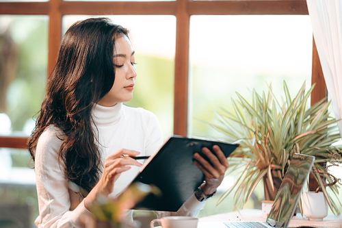 Portrait of young confident smiling Asian business woman leader, successful entrepreneur, elegant professional company executive ceo manager, working in co-working space business office