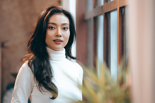 Portrait of young confident smiling Asian business woman leader, successful entrepreneur, elegant professional company executive ceo manager, working in co-working space business office