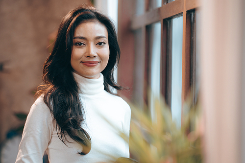 Portrait of young confident smiling Asian business woman leader, successful entrepreneur, elegant professional company executive ceo manager, working in co-working space business office