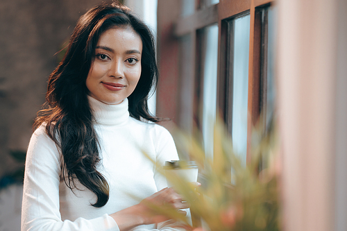 Portrait of young confident smiling Asian business woman leader, successful entrepreneur, elegant professional company executive ceo manager, working in co-working space business office