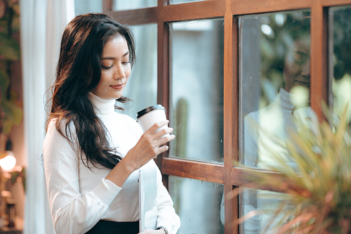 Portrait of young confident smiling Asian business woman leader, successful entrepreneur, elegant professional company executive ceo manager, working in co-working space business office