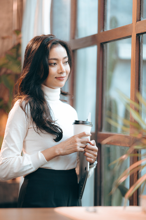 Portrait of young confident smiling Asian business woman leader, successful entrepreneur, elegant professional company executive ceo manager, working in co-working space business office