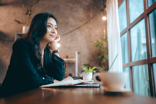 Portrait of young confident smiling Asian business woman leader, successful entrepreneur, elegant professional company executive ceo manager, working in co-working space business office