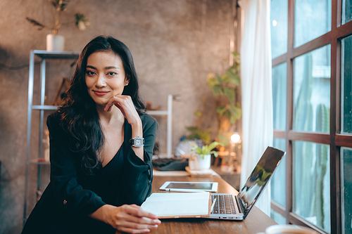 Portrait of young confident smiling Asian business woman leader, successful entrepreneur, elegant professional company executive ceo manager, working in co-working space business office