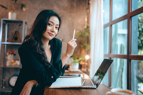 Portrait of young confident smiling Asian business woman leader, successful entrepreneur, elegant professional company executive ceo manager, working in co-working space business office