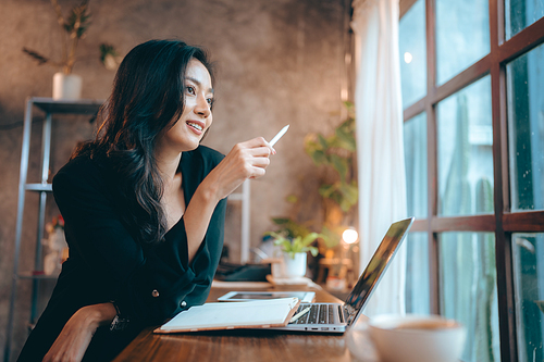 Portrait of young confident smiling Asian business woman leader, successful entrepreneur, elegant professional company executive ceo manager, working in co-working space business office