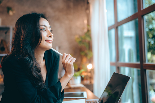 Portrait of young confident smiling Asian business woman leader, successful entrepreneur, elegant professional company executive ceo manager, working in co-working space business office