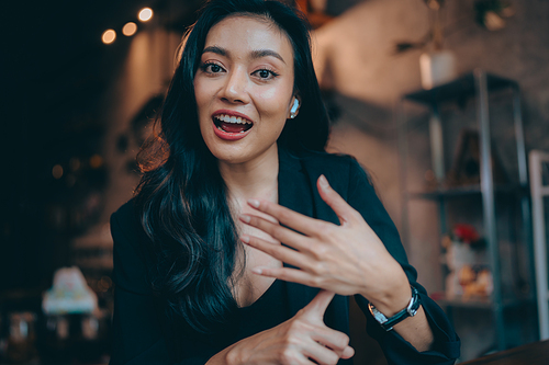 Portrait of young confident smiling Asian business woman leader, successful entrepreneur, elegant professional company executive ceo manager, working in co-working space business office