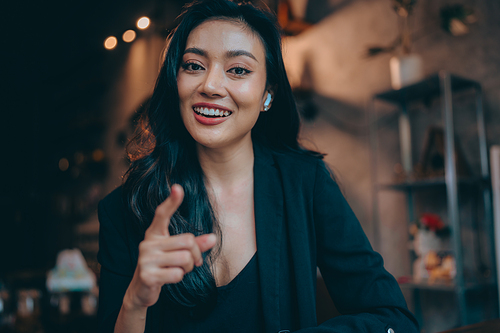 Portrait of young confident smiling Asian business woman leader, successful entrepreneur, elegant professional company executive ceo manager, working in co-working space business office