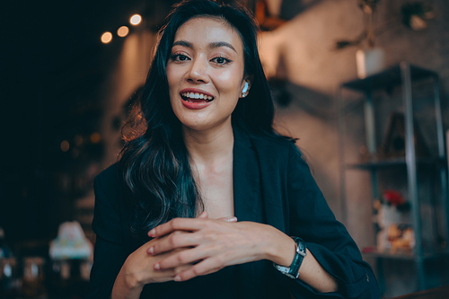 Portrait of young confident smiling Asian business woman leader, successful entrepreneur, elegant professional company executive ceo manager, working in co-working space business office