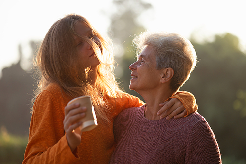 happiness female childhood family bonding mother lifestyle at nature outdoors, children daughter girl having affectionate embracing love with eltern woman, cheerful hug and smiling togetherness