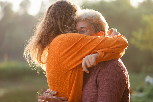 happiness female childhood family bonding mother lifestyle at nature outdoors, children daughter girl having affectionate embracing love with eltern woman, cheerful hug and smiling togetherness