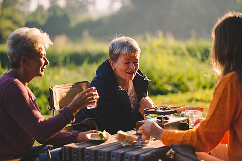 mother and children lifestyle in vacation camping concept, nature, woman person family are happy fun to eating picnic breakfast food at outdoors summer travel, girl with adventure trip holiday leisure