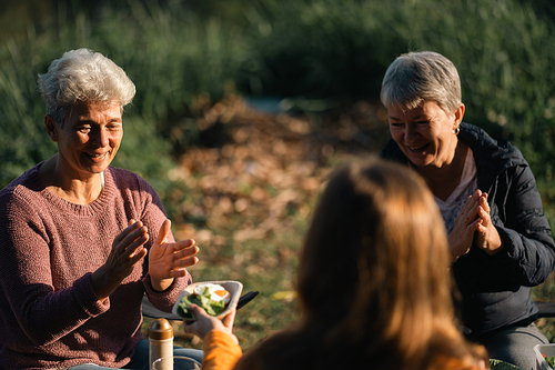 mother and children lifestyle in vacation camping concept, nature, woman person family are happy fun to eating picnic breakfast food at outdoors summer travel, girl with adventure trip holiday leisure