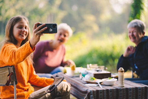 mother and children lifestyle in vacation camping concept, nature, woman person family are happy fun to eating picnic breakfast food at outdoors summer travel, girl with adventure trip holiday leisure