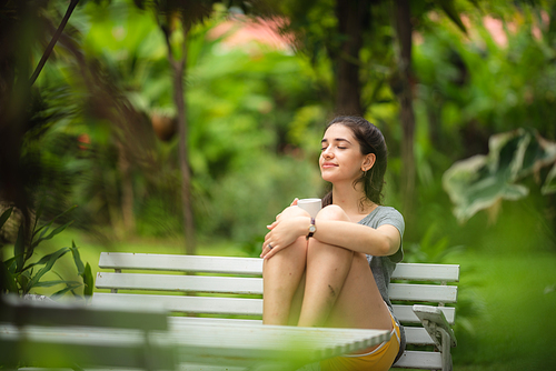 young beautiful woman person are happy and enjoy with coffee drink in the morning at home, relax lifestyle by holding coffee or tea cup at nature outdoor park, smile pretty girl with freedom time