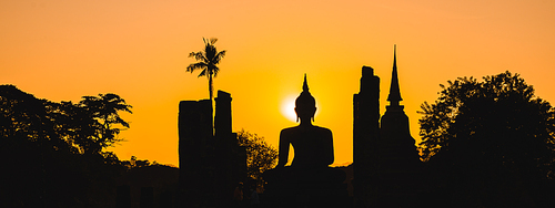 Historic Town of Sukhothai temple park, Ancient Buddha Statue at sunset Sukhothai historical park, Mahathat Temple