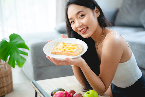 young Asian woman girl holding health food fresh vegetable in lifestyle at home, female beautiful vegetarian person doing diet nourishment eat salad meal, people are smile happy, healthy food concept