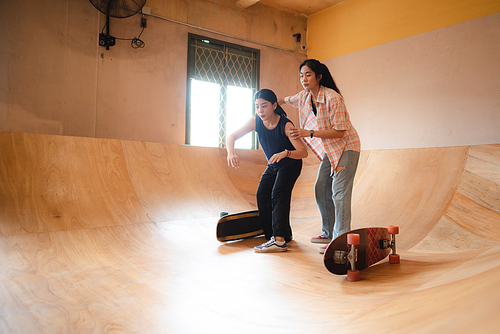 young woman person playing skate active fun, sport trainer lifestyle concept with skateboarder