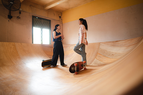 young woman person playing skate active fun, sport trainer lifestyle concept with skateboarder