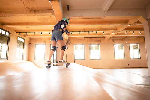 young woman playing extreme skateboard, skate sport lifestyle in urban hobby