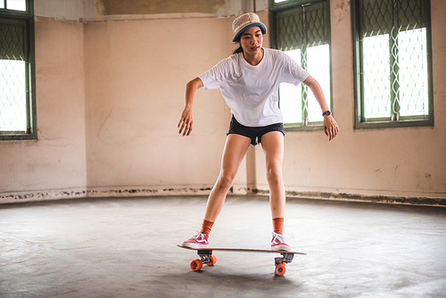 young Asian girl lifestyle, woman having fun with skate sport, skateboard fashion style