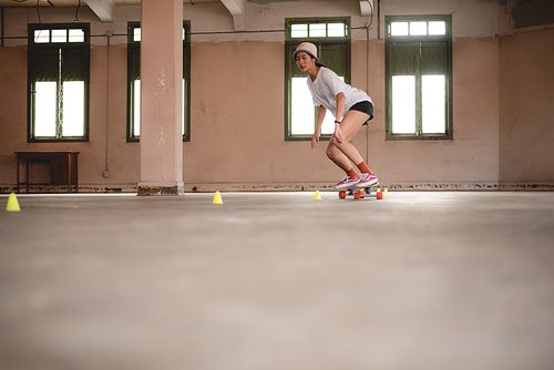 young woman playing extreme skateboard, skate sport lifestyle in urban hobby