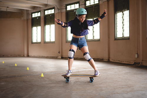 young woman playing extreme skateboard, skate sport lifestyle in urban hobby