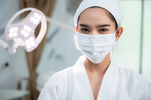 young woman patient with a therapy treatment of cosmetic face skin, surgery medicine concept