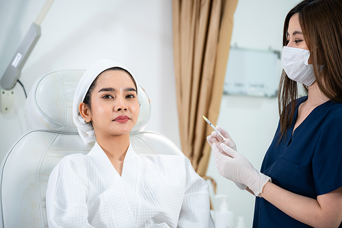 young Asian woman making cosmetology treatment skin injection, Mesotherapy of face beauty care