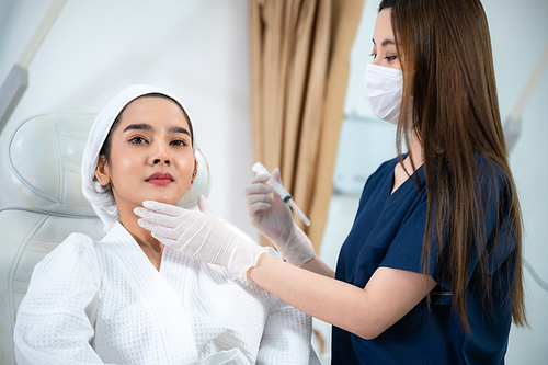 young Asian woman making cosmetology treatment skin injection, Mesotherapy of face beauty care