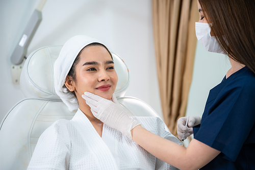 young Asian woman making cosmetology treatment skin injection, Mesotherapy of face beauty care