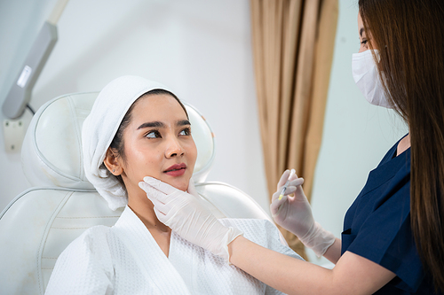 young Asian woman making cosmetology treatment skin injection, Mesotherapy of face beauty care