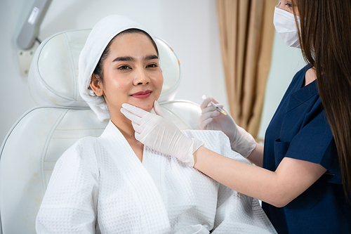 young Asian woman making cosmetology treatment skin injection, Mesotherapy of face beauty care