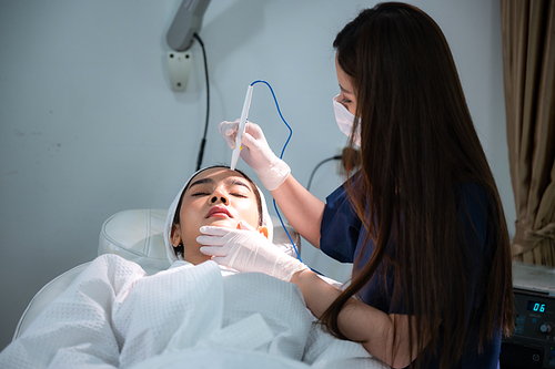 young Asian woman making cosmetology treatment skin injection, Mesotherapy of face beauty care